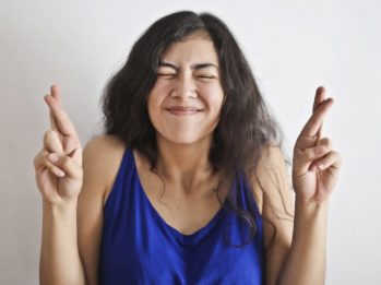 Woman in Blue Tank Top Smiling
