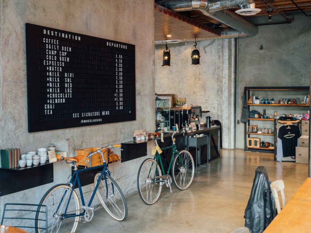two bikes parked beside wall inside room
